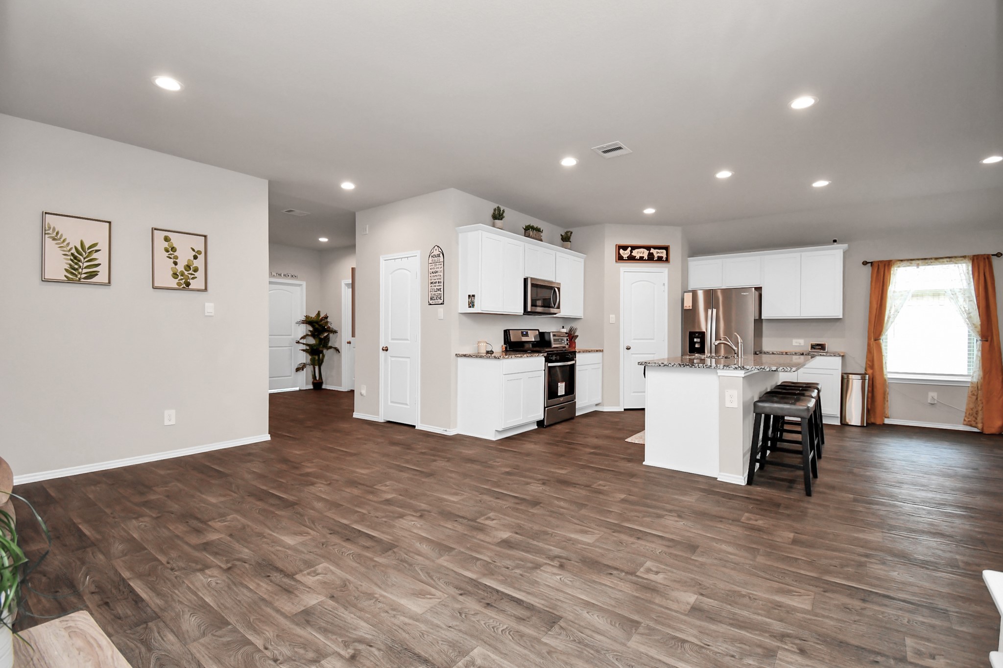 3610 Crimson Embers Lane Conroe, TX 77301 - Photo 11 of 41 a view of kitchen with kitchen island and stainless steel appliances