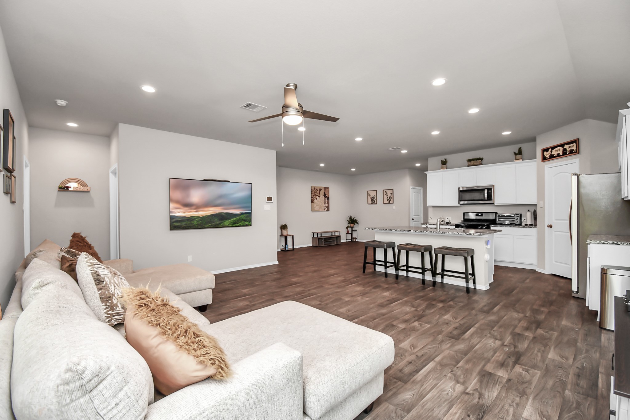 3610 Crimson Embers Lane Conroe, TX 77301 - Photo 19 of 41 a living room with furniture and kitchen view
