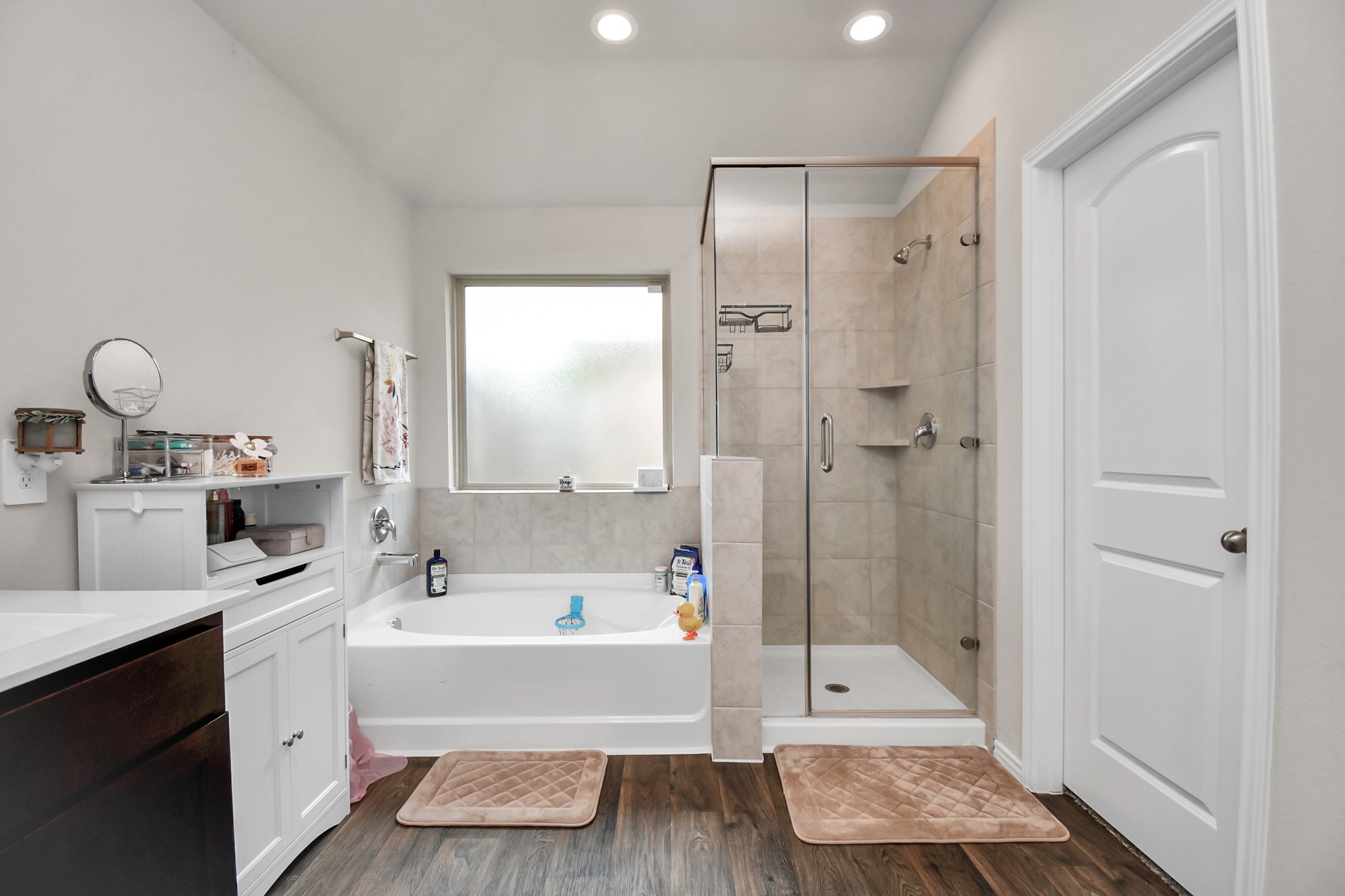 3610 Crimson Embers Lane Conroe, TX 77301 - Photo 30 of 41 a bathroom with a tub a sink and a mirror