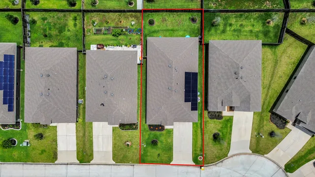 aerial view of a house with a garden