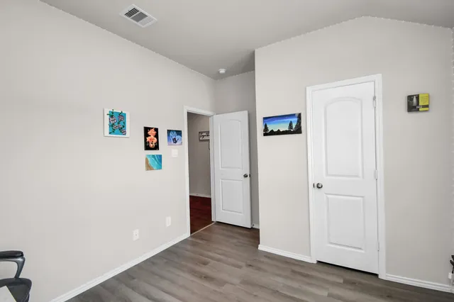 a view of a livingroom with wooden floor
