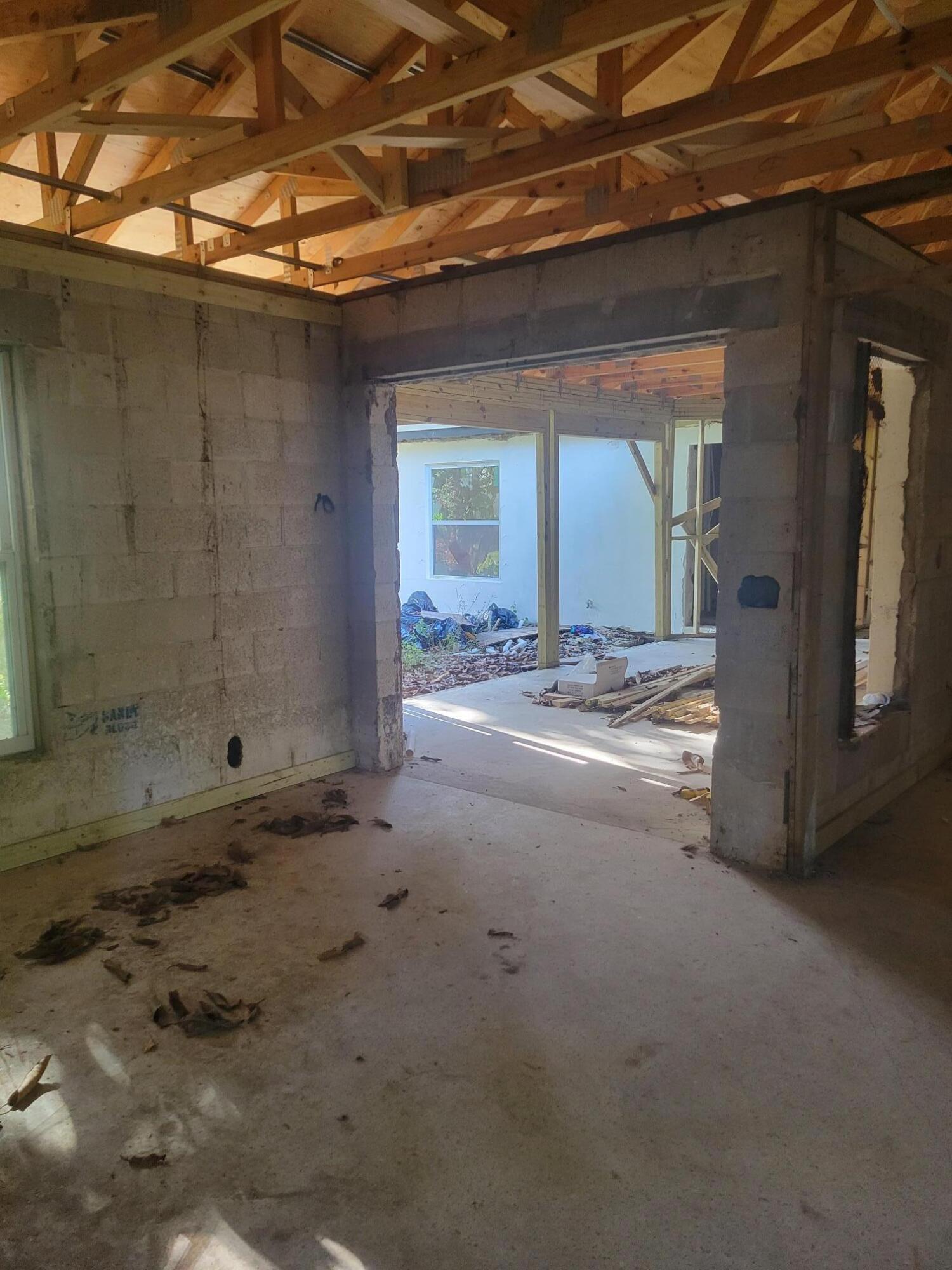 1817 Palm Boulevard Melbourne, FL 32901 - Photo 16 of 35 a view of an empty room with cabinet and a window