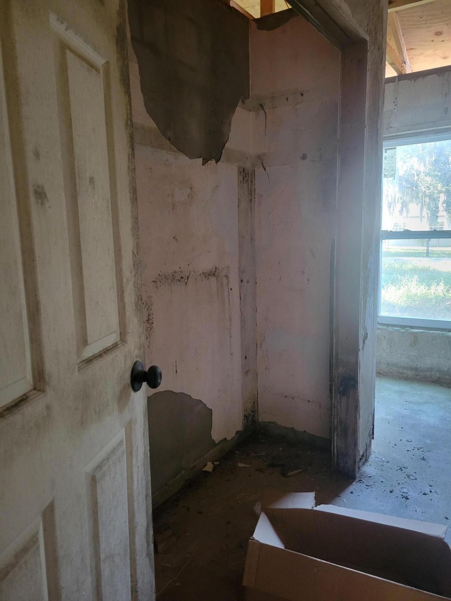 1817 Palm Boulevard Melbourne, FL 32901 - Photo 20 of 35 a room with a chair and glass door