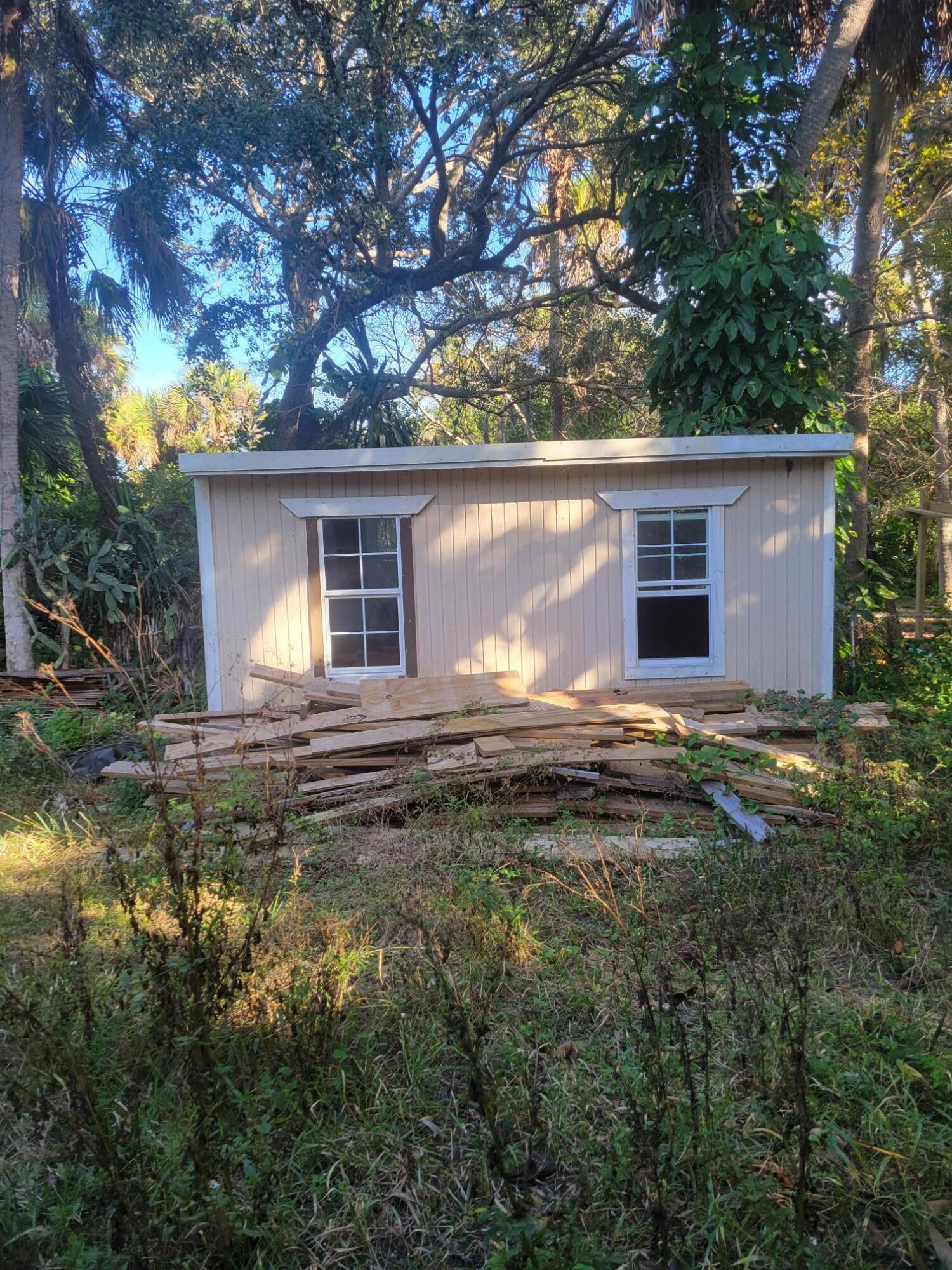 1817 Palm Boulevard Melbourne, FL 32901 - Photo 25 of 35 a view of a house with a yard