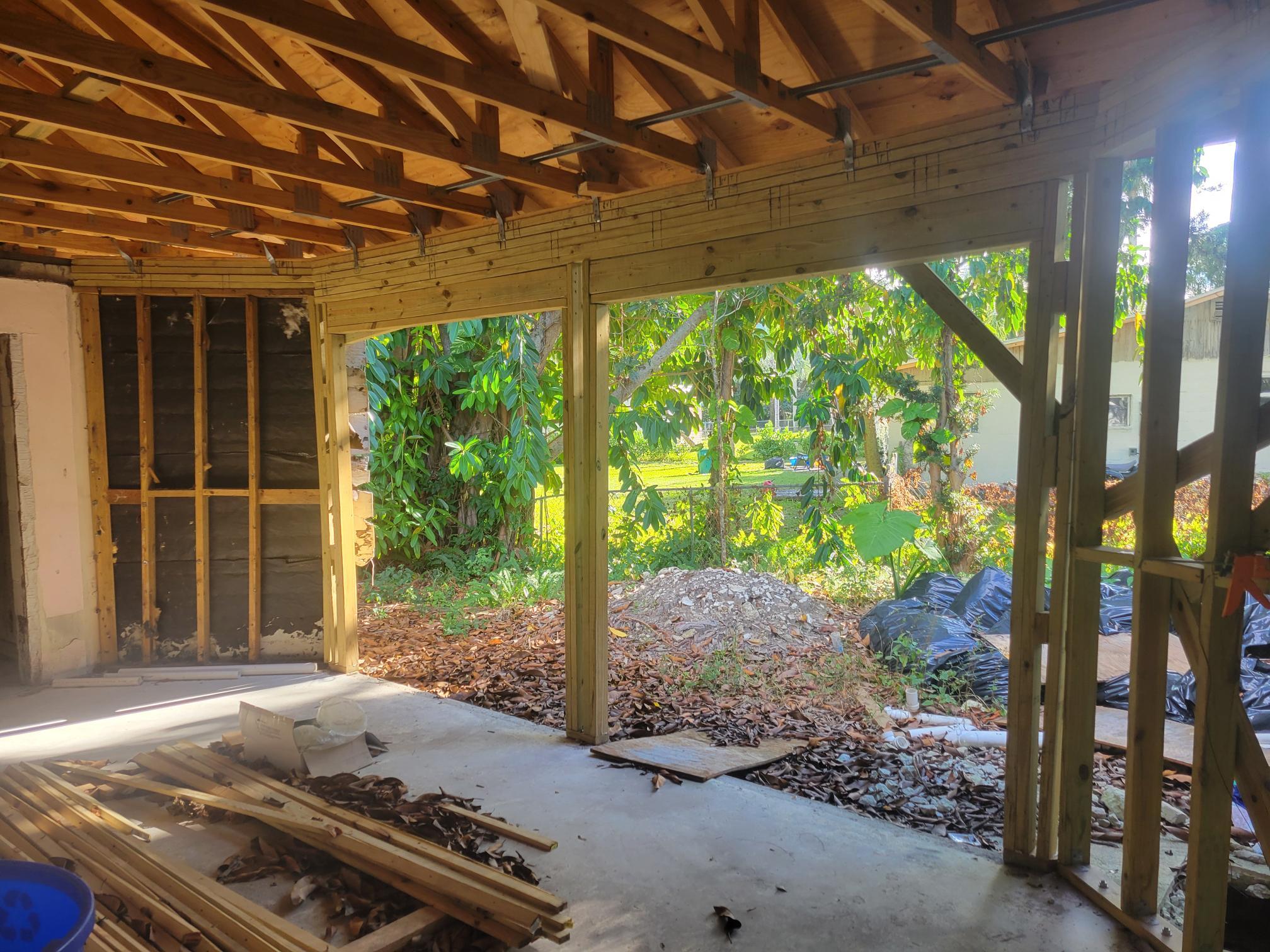 1817 Palm Boulevard Melbourne, FL 32901 - Photo 5 of 35 a wooden bench sitting in front of a building
