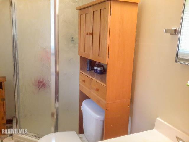12289 Tresemer Road Roscoe, IL 61073 - Photo 13 of 25 a bathroom with a toilet and a sink