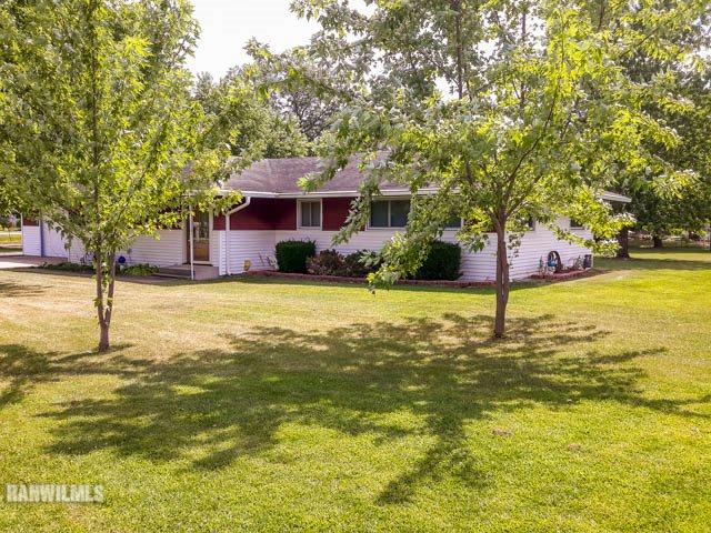 12289 Tresemer Road Roscoe, IL 61073 - Photo 2 of 25 a view of a house with a yard