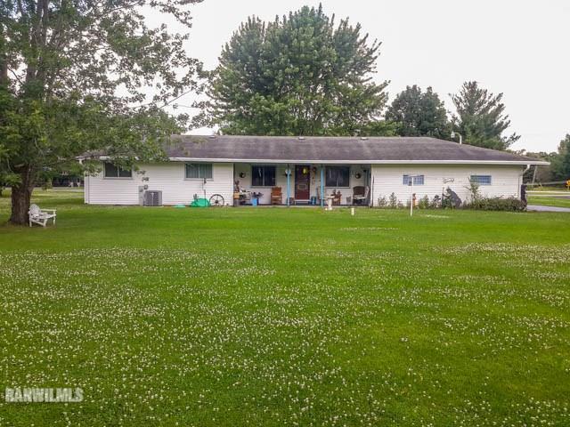 12289 Tresemer Road Roscoe, IL 61073 - Photo 22 of 25 a front view of a house with a garden