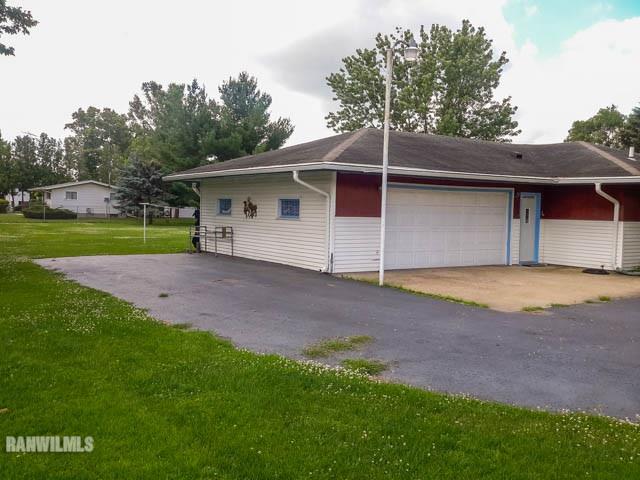 12289 Tresemer Road Roscoe, IL 61073 - Photo 24 of 25 a view of a backyard with a garden