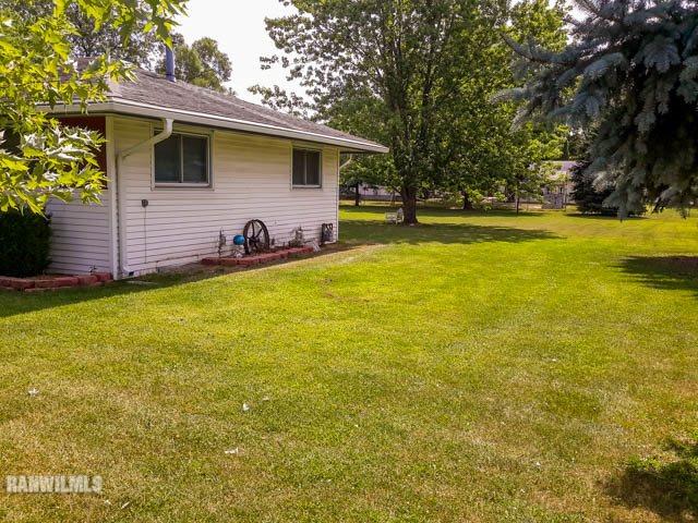 12289 Tresemer Road Roscoe, IL 61073 - Photo 3 of 25 a view of a house with a yard