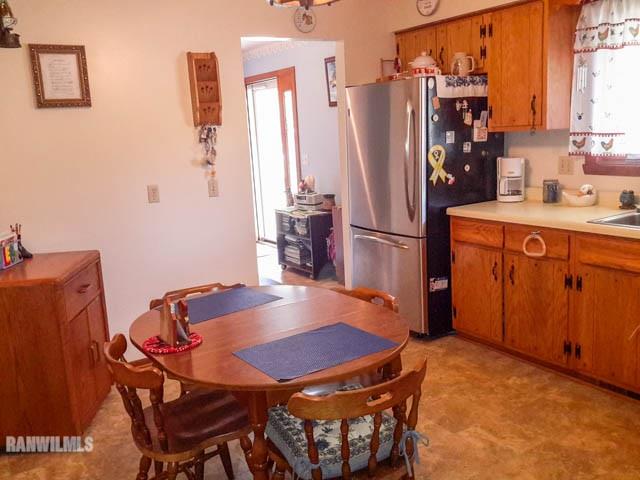 12289 Tresemer Road Roscoe, IL 61073 - Photo 5 of 25 a dining table with chairs and wooden floor