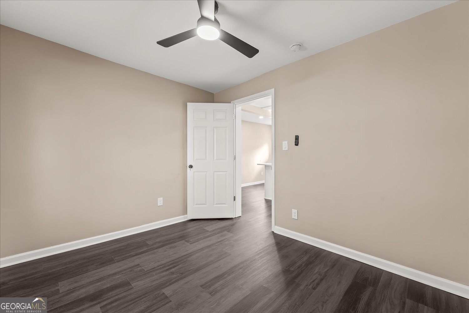 401 Baltimore Road Washington, GA 30673 - Photo 14 of 22 a view of an empty room and wooden floor