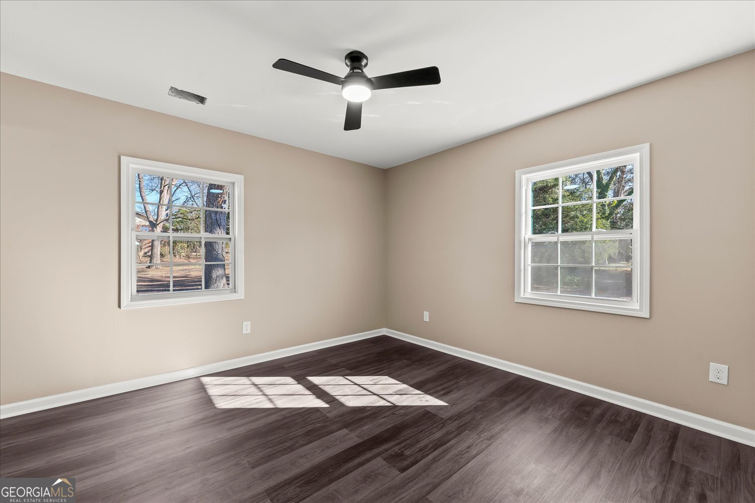 401 Baltimore Road Washington, GA 30673 - Photo 17 of 22 a view of wooden floor and a chandelier fan in a room