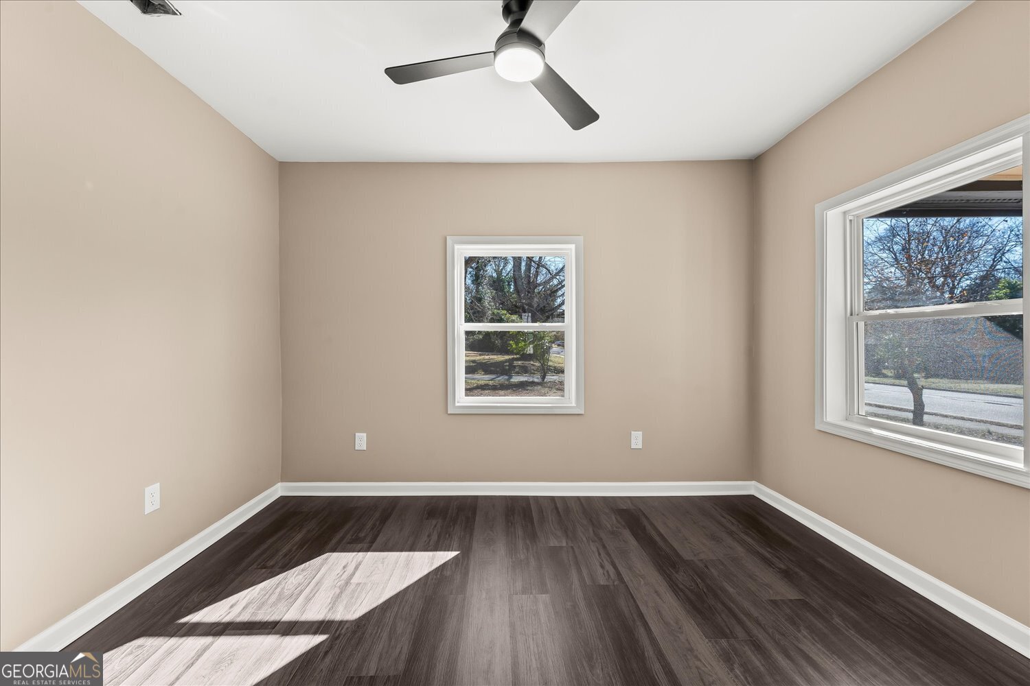 401 Baltimore Road Washington, GA 30673 - Photo 7 of 22 a view of wooden floor and windows in a room