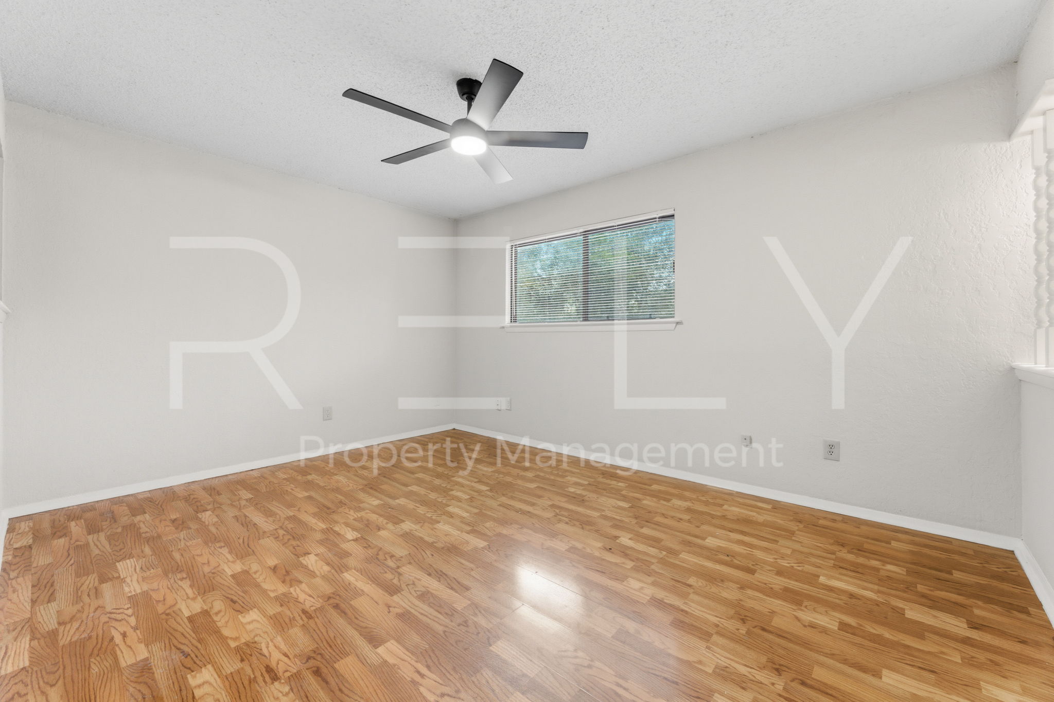1005 Milford Way, Unit A Austin, TX 78745 - Photo 19 of 30 wooden floor in an empty room