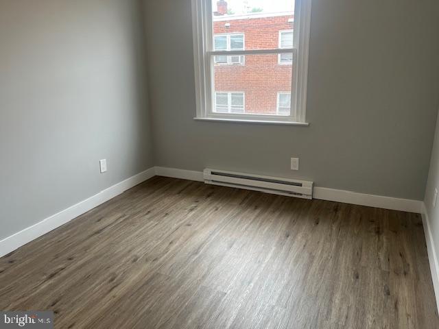 6339 Morton Street Philadelphia, PA 19144 - Photo 13 of 14 an empty room with wooden floor and windows