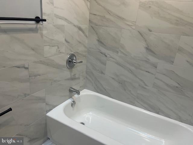 6339 Morton Street Philadelphia, PA 19144 - Photo 10 of 14 a bathroom with a white bath tub and a shower