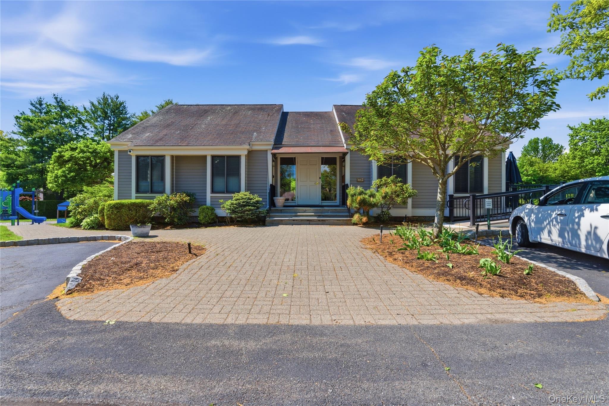 245 Tree Top Crescent Rye Brook, NY 10573 - Photo 17 of 24 front view of house with a yard