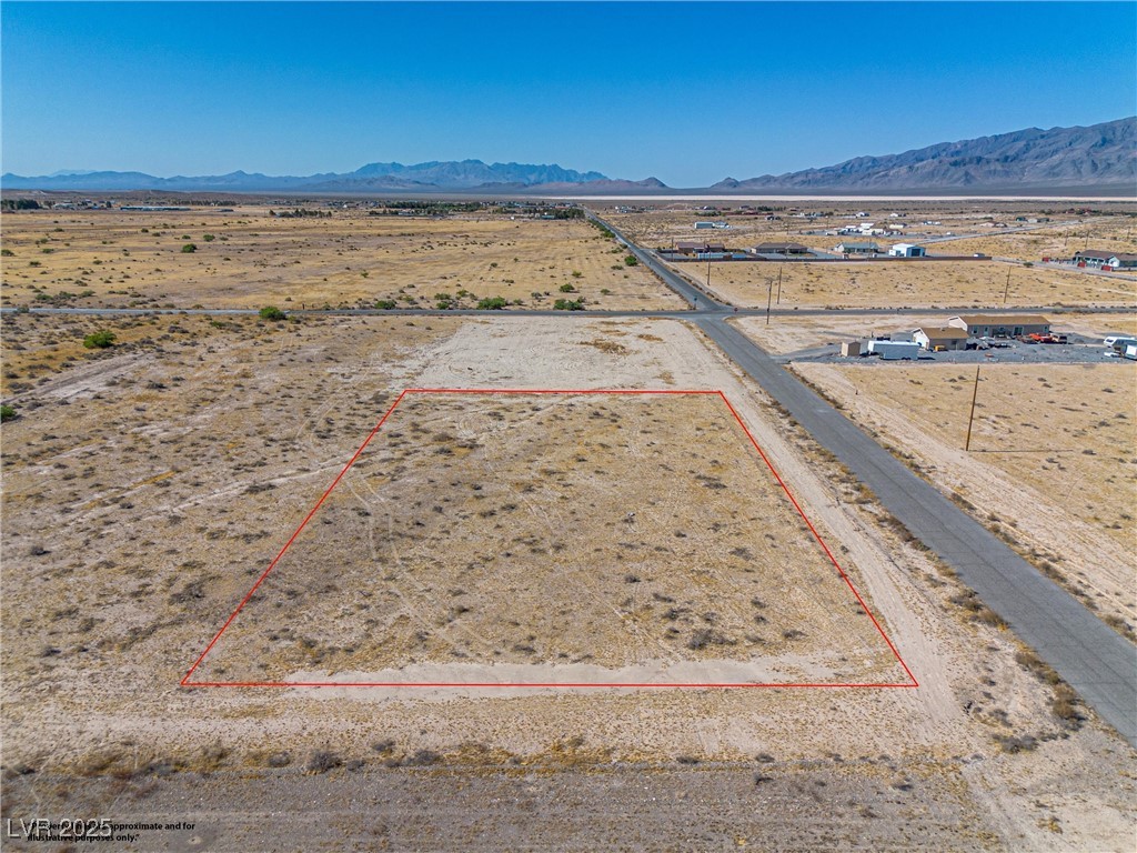 2021 Ricky Road Pahrump, NV 89048 - Photo 3 of 16 Overhead view of the property looking towards Thorne Dr in the background and Vicki Ann Rd to the right. The highlight of the property boundaries are not meant to show the actual property lines