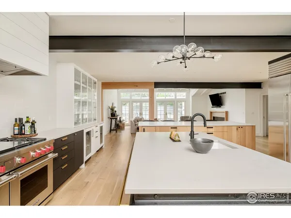 a view of a kitchen with a dining table chairs and a stove