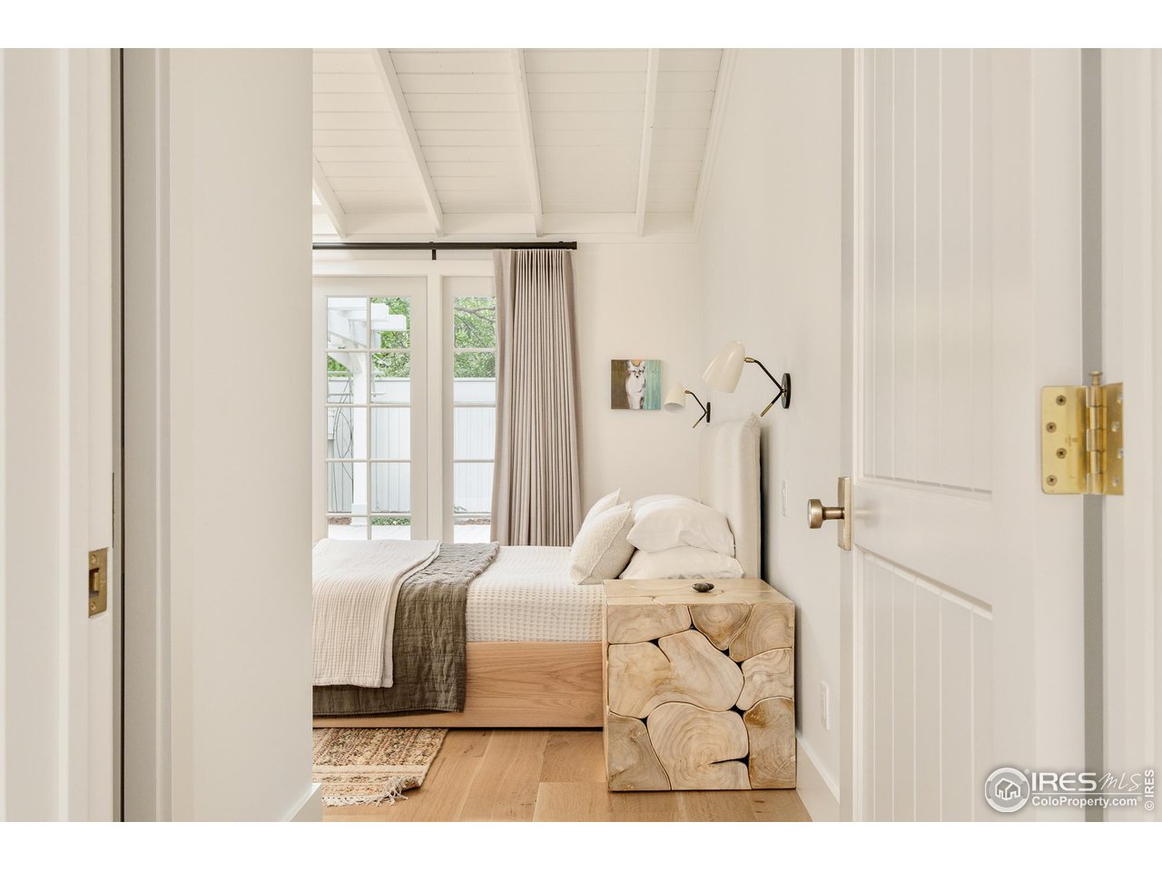 656 Juniper Avenue Boulder, CO 80304 - Photo 18 of 49 a bedroom with a bed and a window