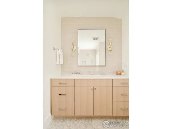 a bathroom with a sink a mirror and a