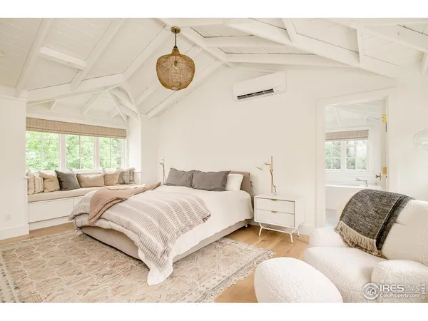 a living room with a flat screen tv and a fireplace