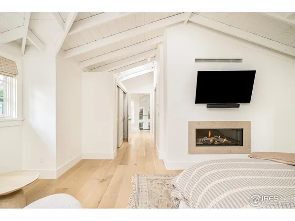 a bathroom with a double vanity sink mirror and shower