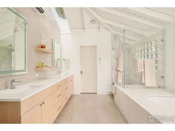 a bathroom with a bathtub and a shower