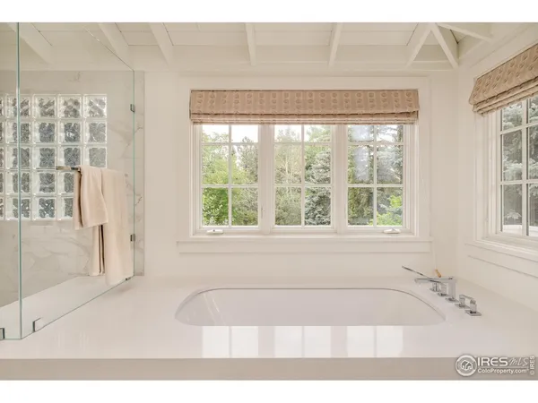 a en suite bathroom with a sink a mirror and a shower