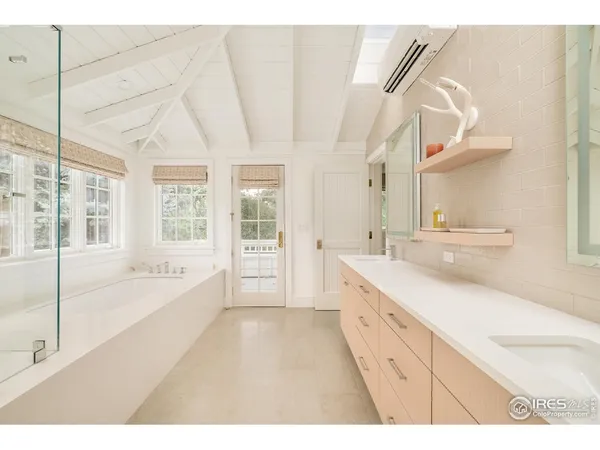 a view of a living room with a floor to ceiling window and floor