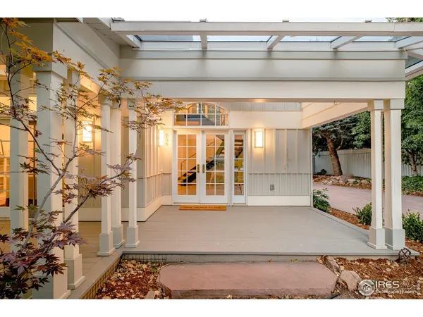 a view of a patio with wooden floor