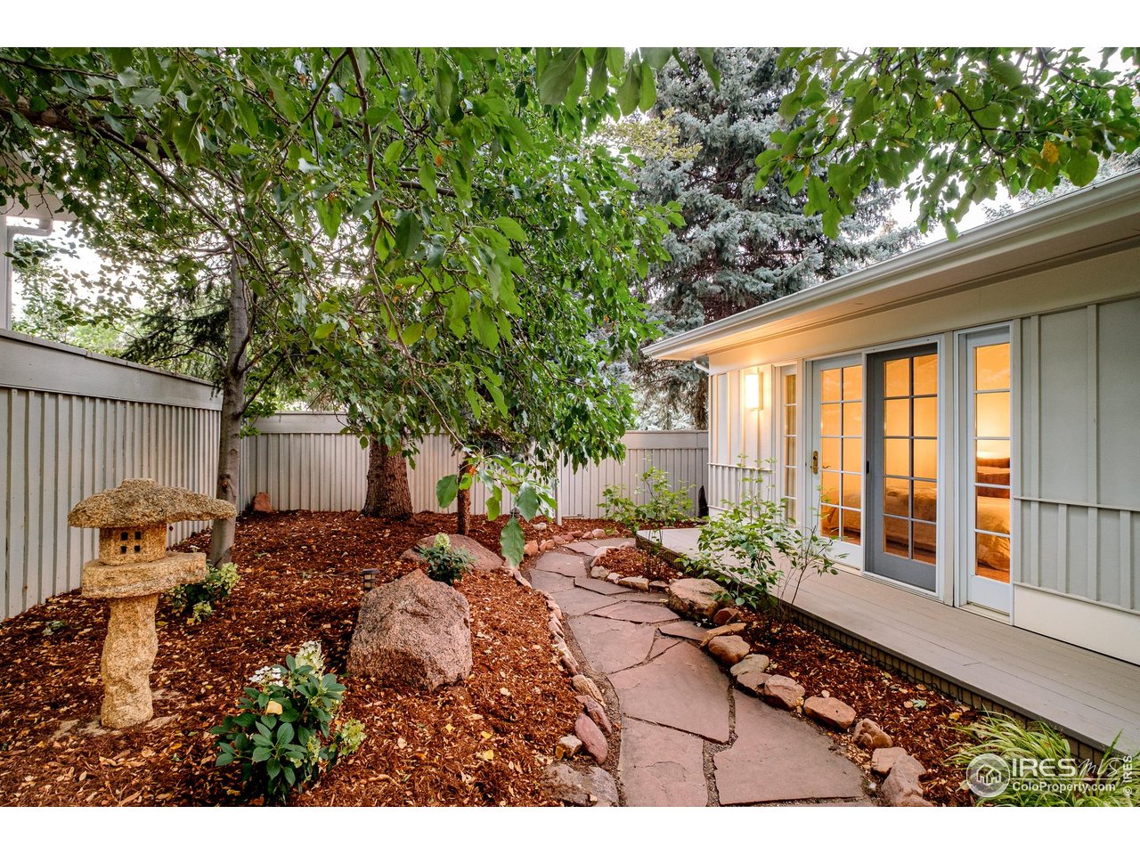656 Juniper Avenue Boulder, CO 80304 - Photo 43 of 49 a backyard of a house with table and chairs