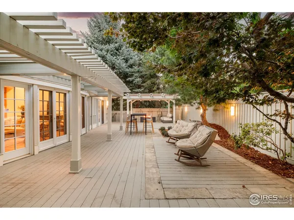 a front view of a building with a garden