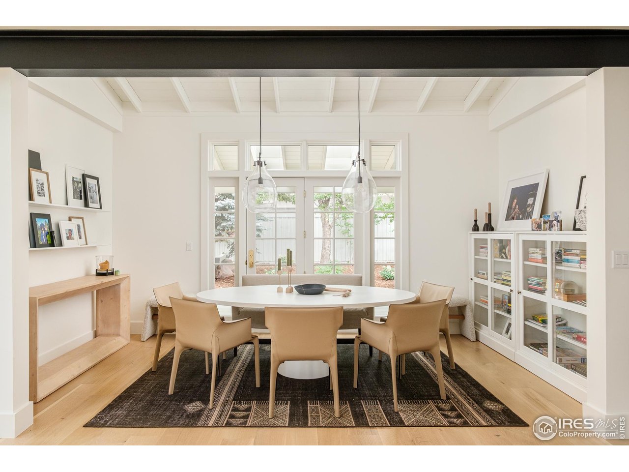 656 Juniper Avenue Boulder, CO 80304 - Photo 7 of 49 a view of a dining room with furniture and wooden floor