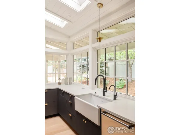 a kitchen with a sink and a window