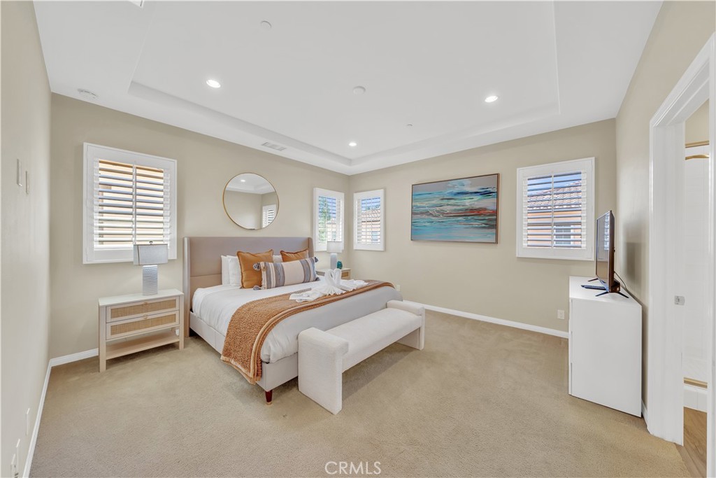 75 Gardenstone Path Irvine, CA 92620 - Photo 26 of 65 a bed room with a bed and a night stand