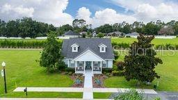 Tbd Southeast 47th Terrace Ocala, FL 34480 - Photo 14 of 18 a front view of a house with garden