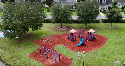 an aerial view of a house with yard swimming pool and outdoor seating