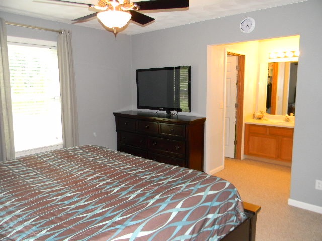 6688 North Point Road Rockford, IL 61108 - Photo 11 of 24 a bedroom with a bed and a chandelier