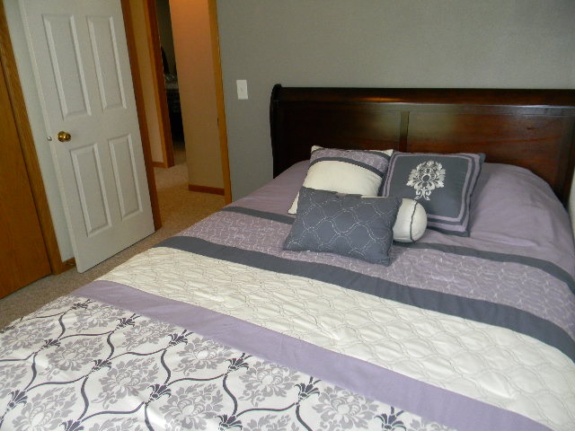 6688 North Point Road Rockford, IL 61108 - Photo 14 of 24 a bedroom with a bed and a mirror