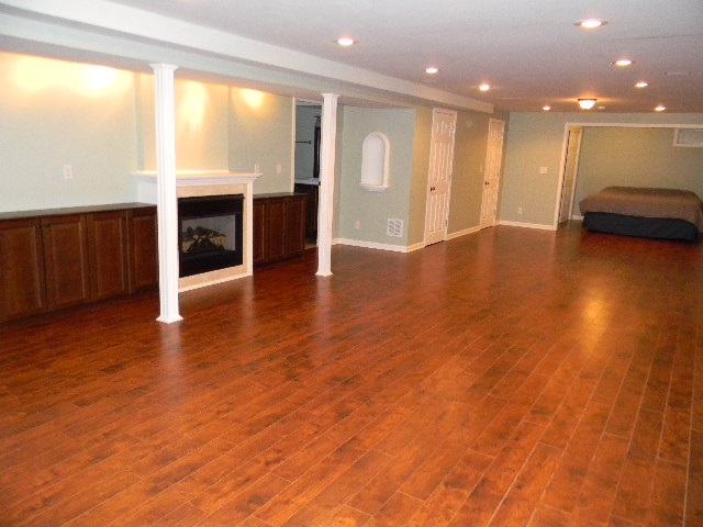 6688 North Point Road Rockford, IL 61108 - Photo 18 of 24 a view of a room with wooden floor and windows