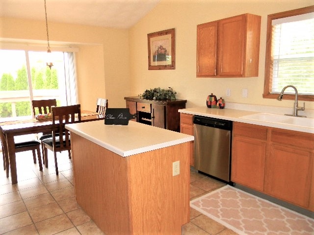 6688 North Point Road Rockford, IL 61108 - Photo 2 of 24 a kitchen with a sink a stove and chairs