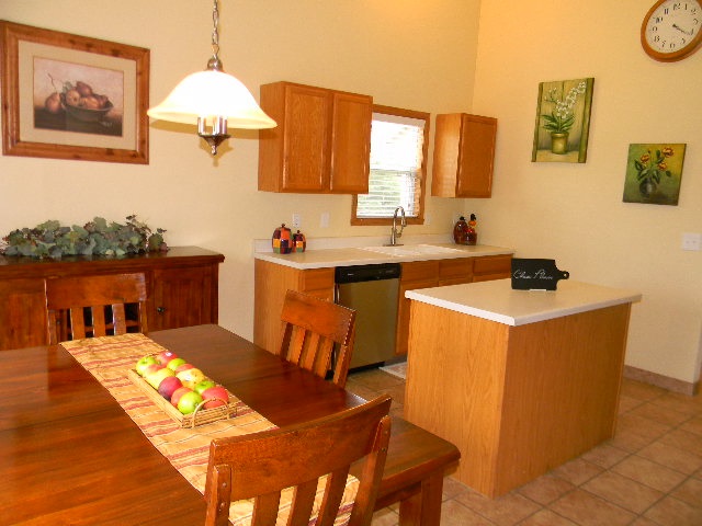 6688 North Point Road Rockford, IL 61108 - Photo 5 of 24 a kitchen with a sink cabinets and window