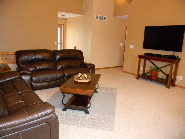 6688 North Point Road Rockford, IL 61108 - Photo 7 of 24 a living room with furniture and a flat screen tv