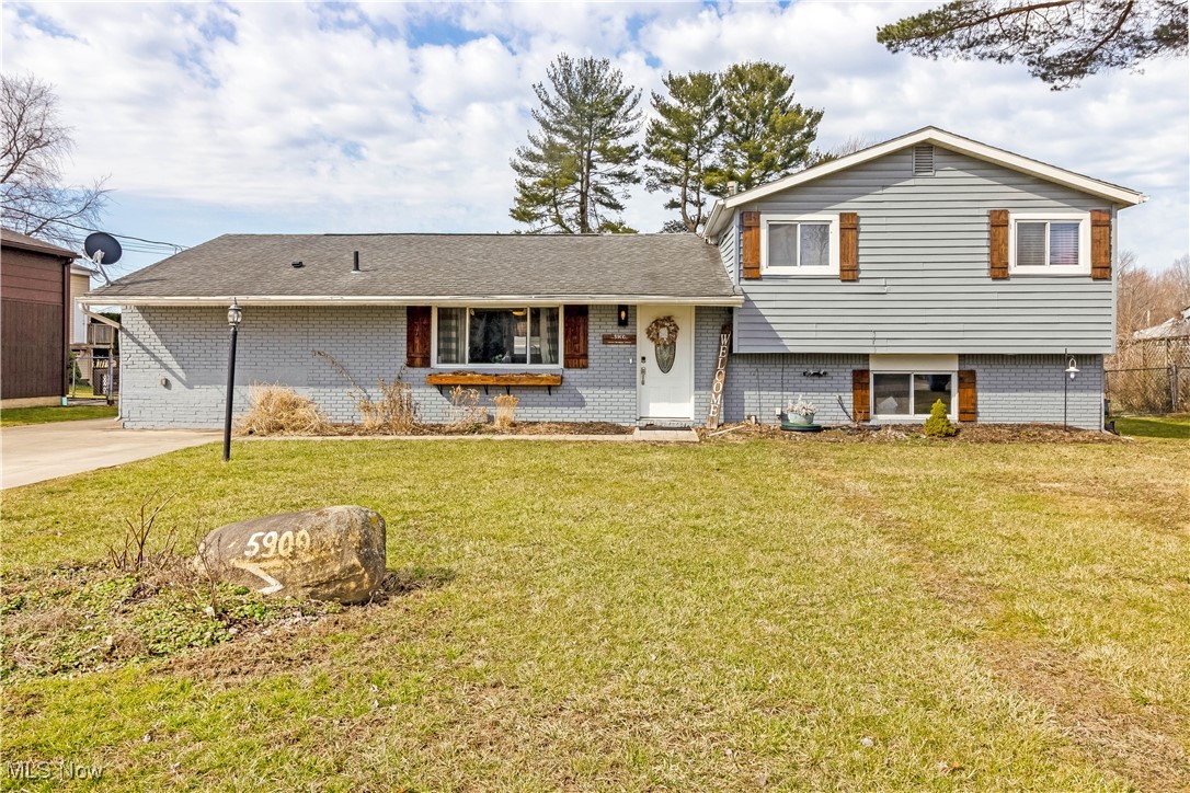 5900 Lear Nagle Road North Ridgeville, OH 44039 - Photo 1 of 35 Split level home with a front yard, brick siding, driveway, and a shingled roof