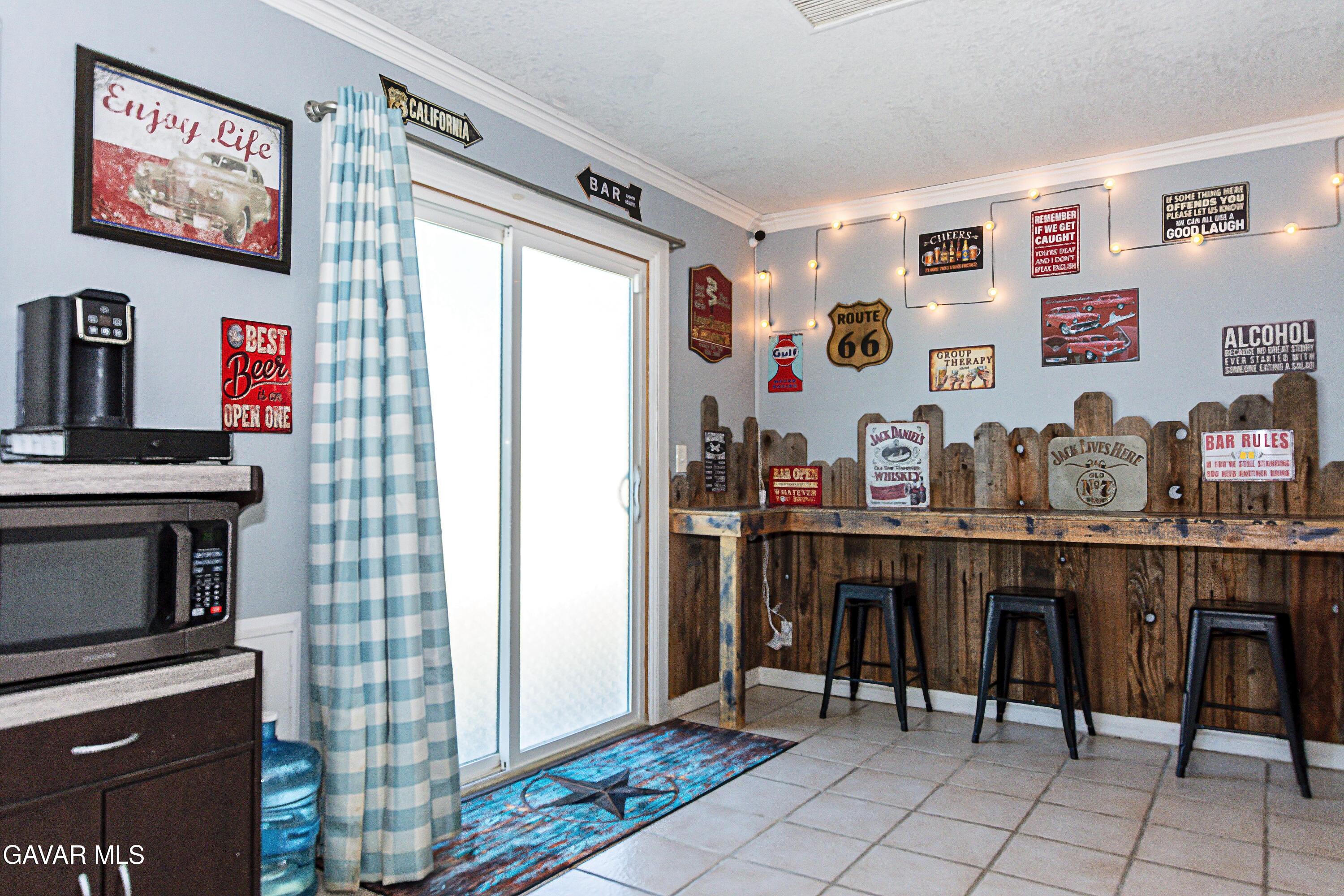 42933 Alexo Drive Lancaster, CA 93536 - Photo 16 of 32 a very nice looking room with many windows and furniture