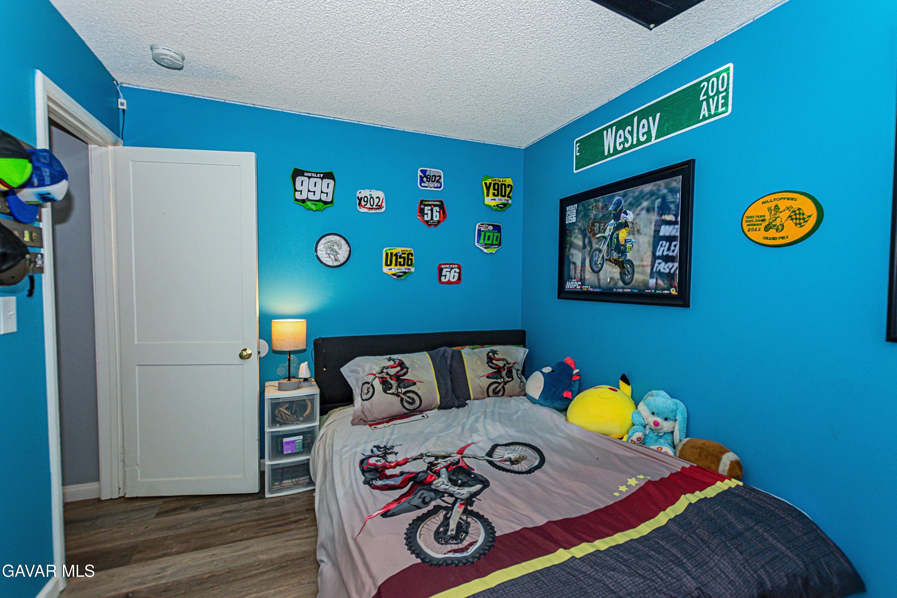 42933 Alexo Drive Lancaster, CA 93536 - Photo 23 of 32 a bedroom with a bed and a window