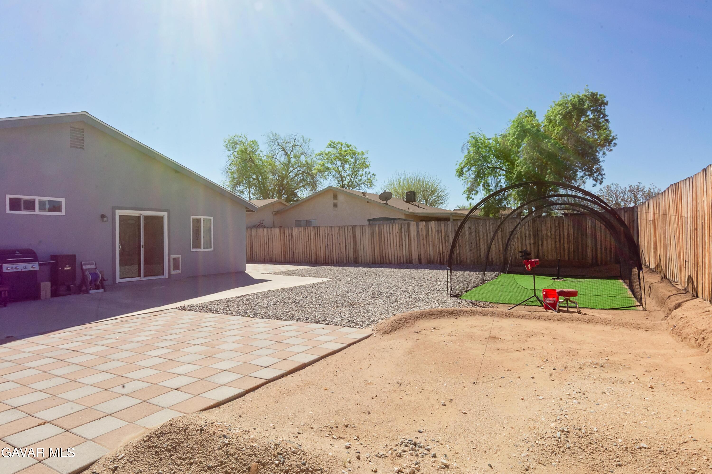 42933 Alexo Drive Lancaster, CA 93536 - Photo 29 of 32 a garden with trees in front of it