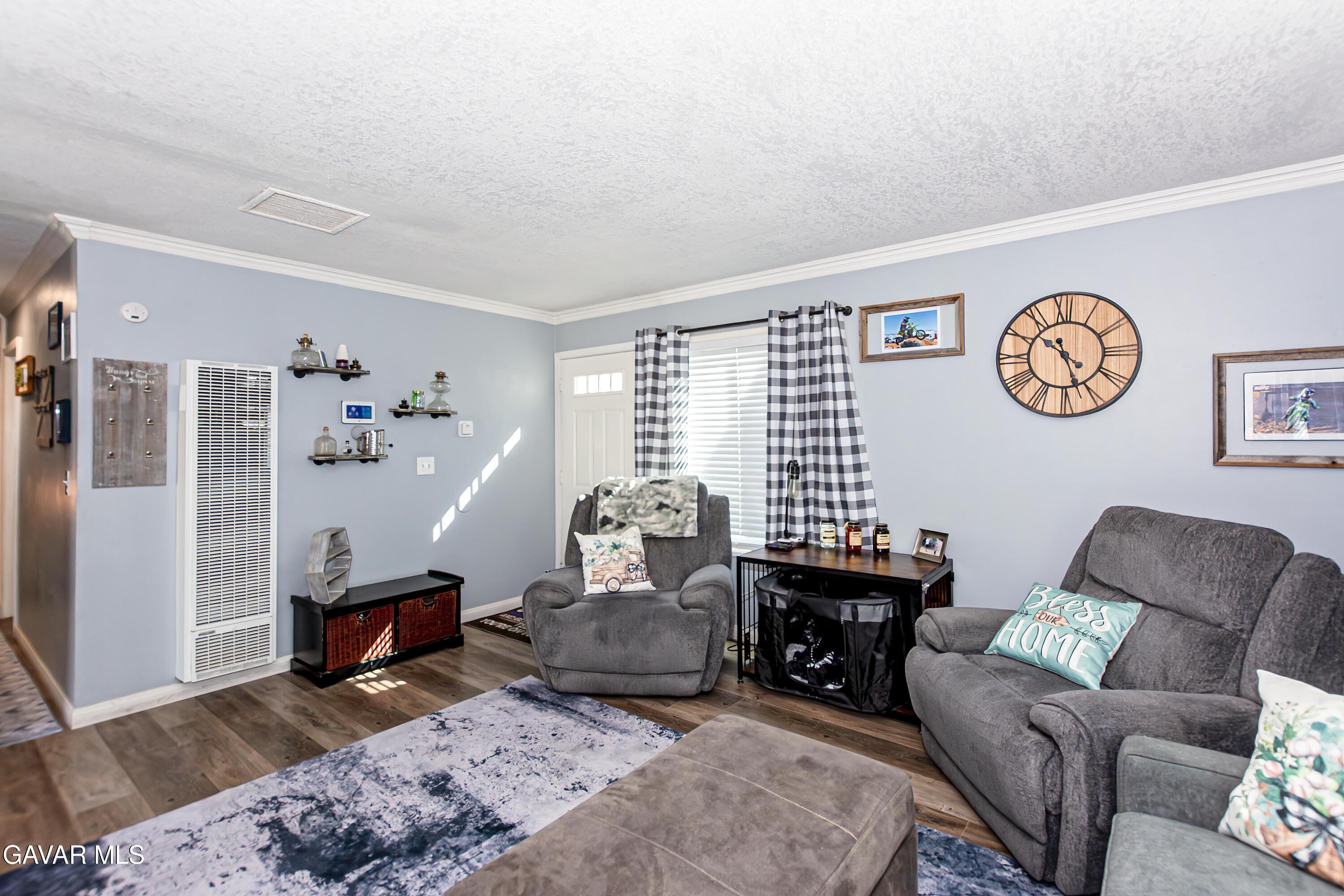 42933 Alexo Drive Lancaster, CA 93536 - Photo 9 of 32 a living room with furniture and a table